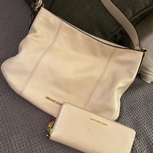 Cream colored Michael Kors with matching wallet Very good condition.